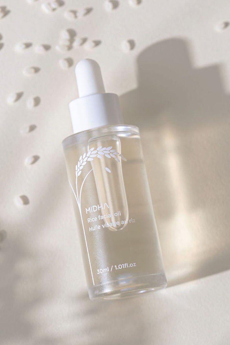 MIDHA Rice Facial Oil 30ml delivers deep hydration and a radiant glow while helping to restore skin’s natural balance.  Its lightweight formula absorbs quickly, leaving no greasy residue—just smooth, nourished, and healthy-looking skin. - Image 1