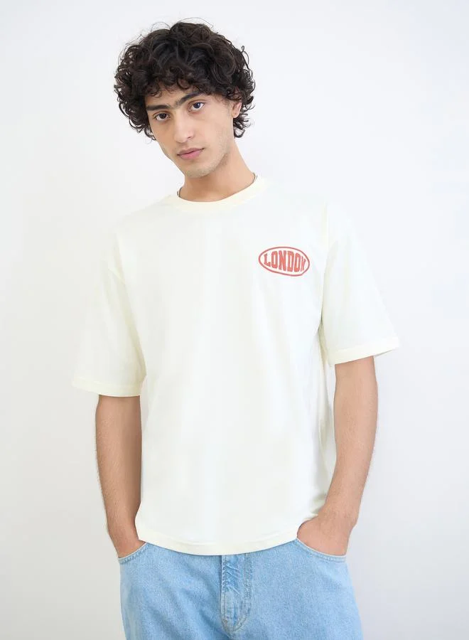Styli Cream Men Text Print Oversized Jersey T-Shirt for Men | Best Price UAE