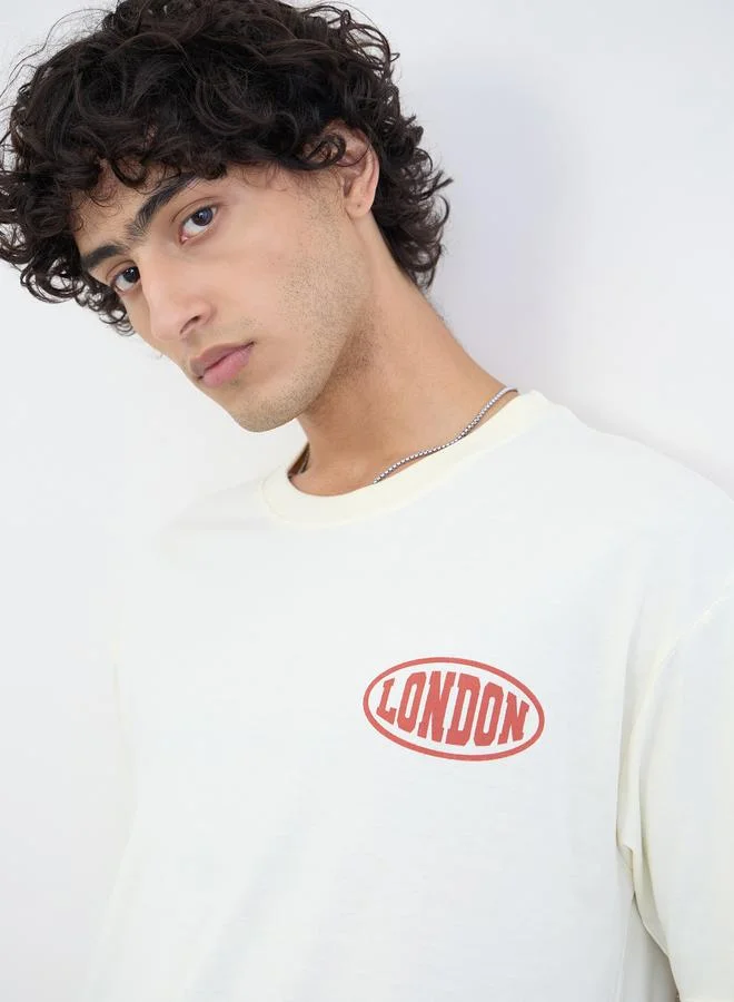 Styli Cream Men Text Print Oversized Jersey T-Shirt for Men | Best Price UAE