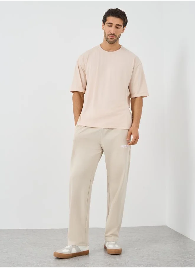 ستايلي Styli Slogan Print Relaxed Fit Open Hem Jogger