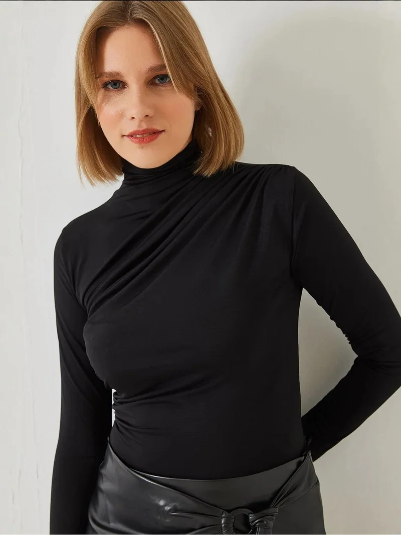 Bianco Lucci LUCCI Fitted Turtleneck Blouse with Ruffle Detail