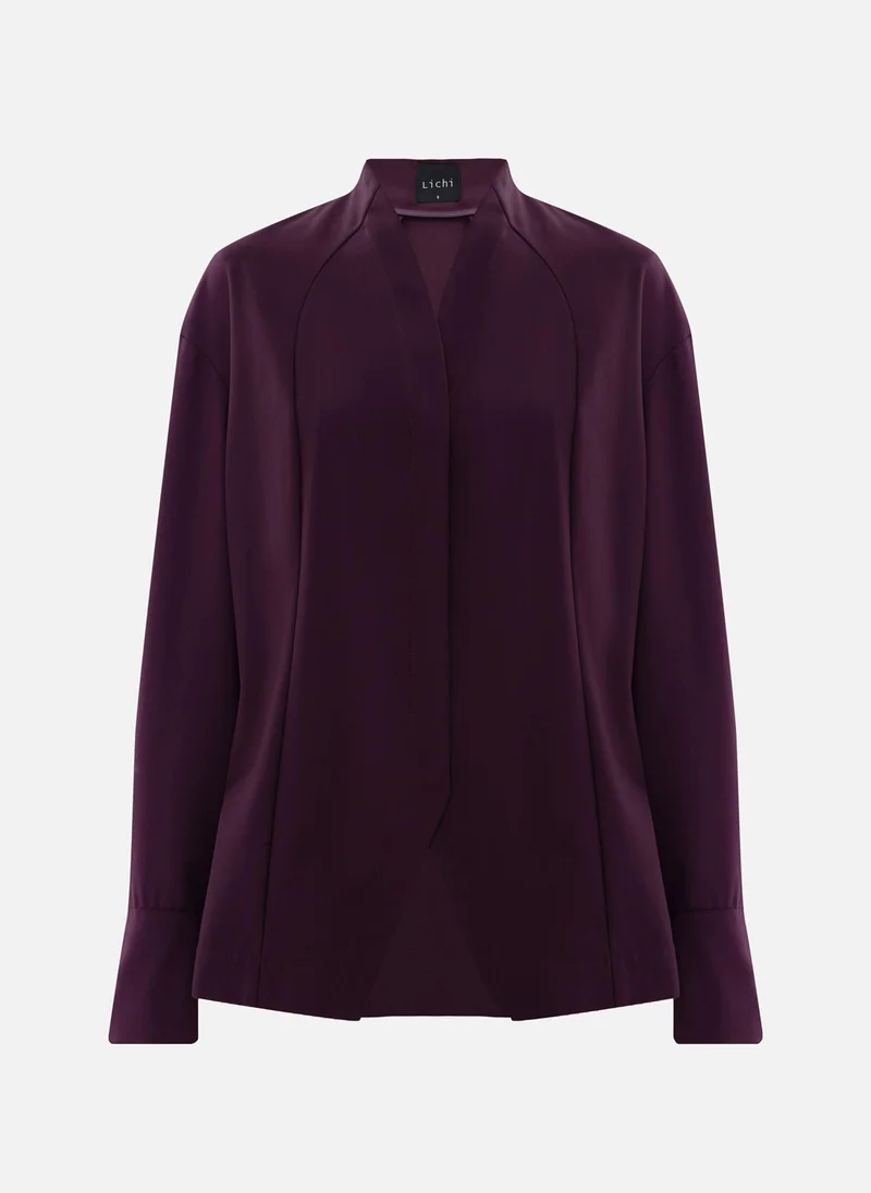 ليتشي قميص بقصّة معقدة مع أزرار مخفية