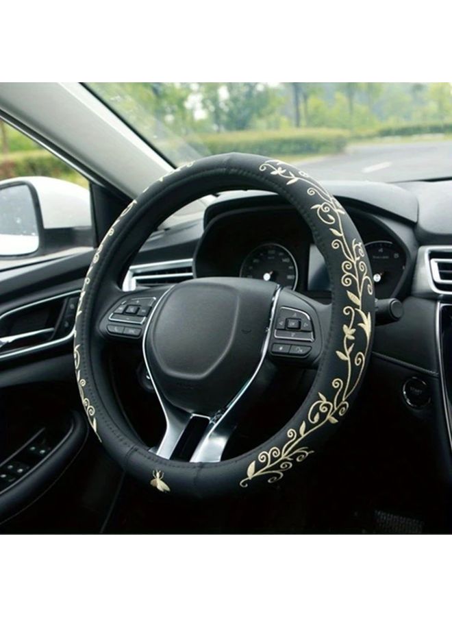 Luxury Faux Leather Steering Wheel Cover Golden Comfort Grip Anti Slip Design 360 Degree Coverage Elegant Floral Embroidery - Image 1