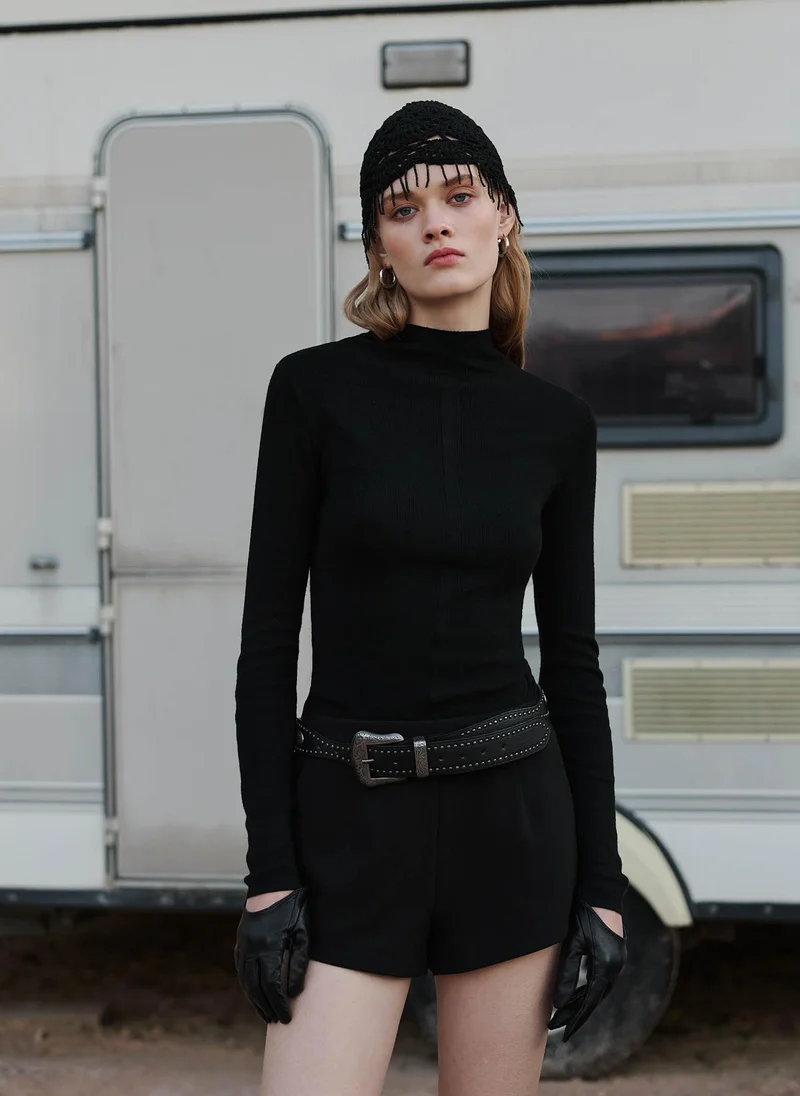 Ribbed turtleneck with a central decor