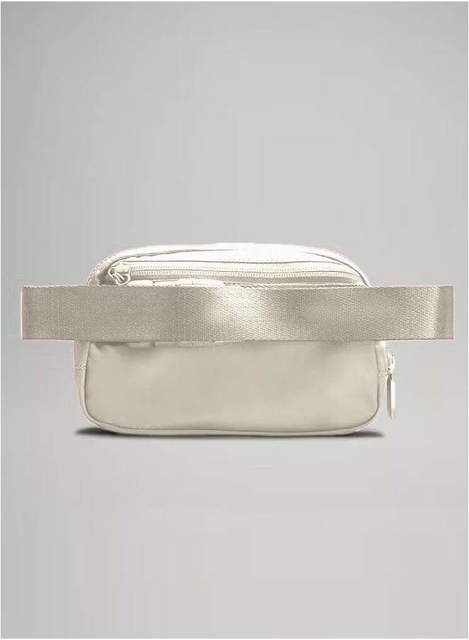 Everywhere Belt Bag, Compact and Convenient Belly Bag with Zippered Pockets, Easy Access Exterior Pocket and Interior Essentials Pocket for On the Go Storage, Cream