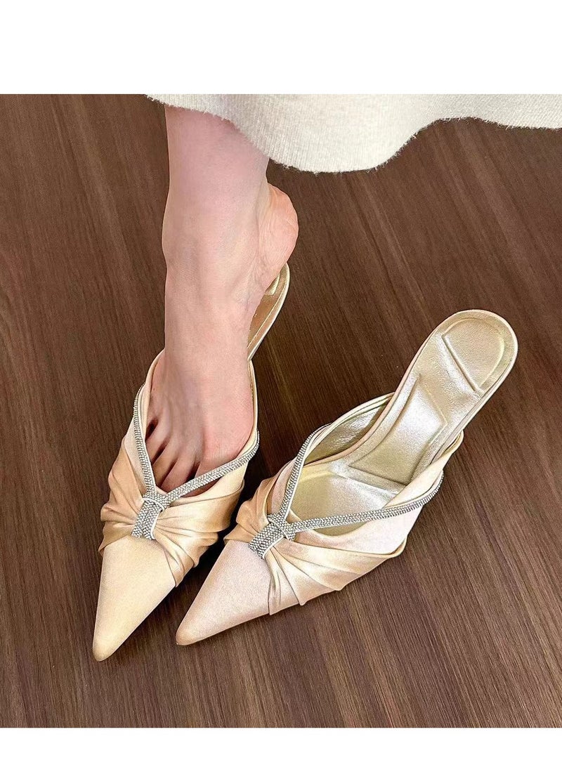 Ladies Wearing Pointed Satin Sandals On The Outside - Image 1
