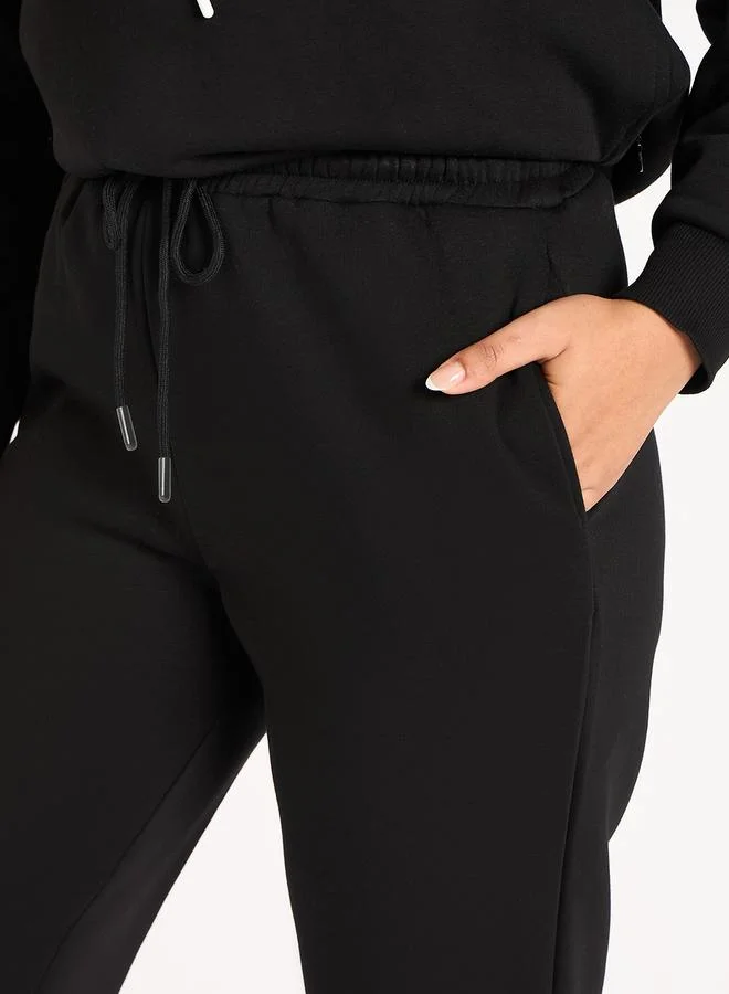 Femmella  Women Black Fleece Joggers for Women | Best Price UAE