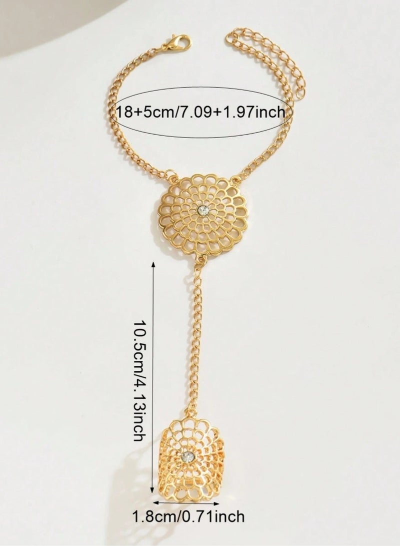 Women's accessory, a finger ring with a chain design connected to a bracelet in gold with a metal flower design, suitable for weddings, engagement parties, Eid and all occasions - Image 3
