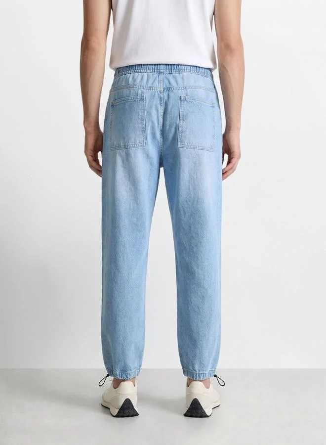 The Indian Garage Co  Men Relaxed Jogger Fit Solid Jeans for Men | Best Price UAE