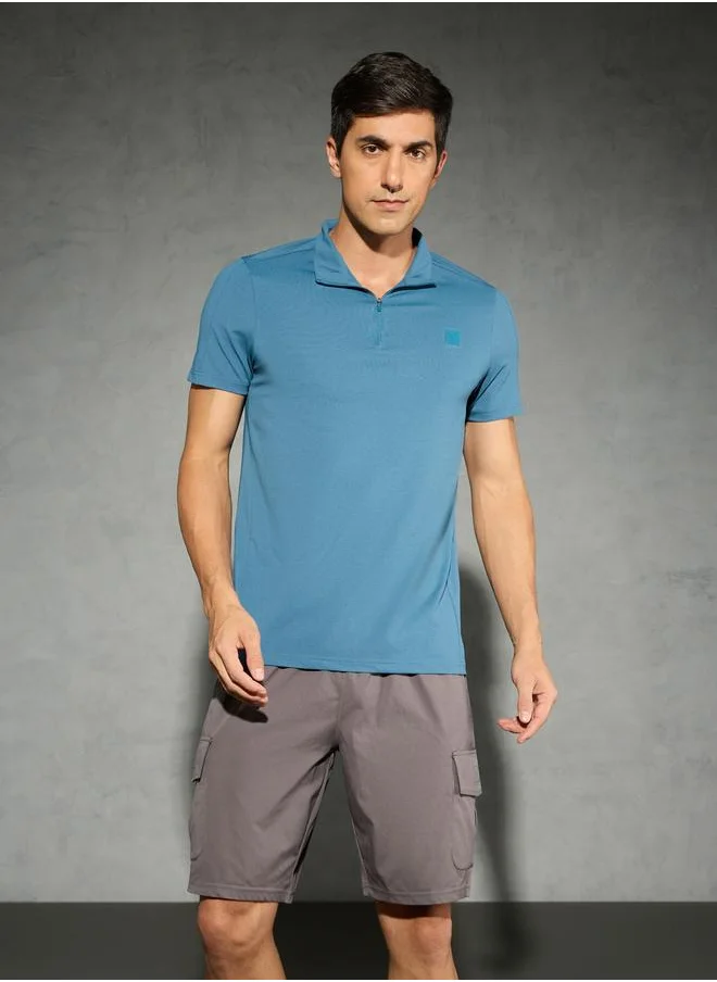 تكنوسبورت Technosport Solid 4-Way Stretch Half Zip Front Slim Fit Polo T-Shirt