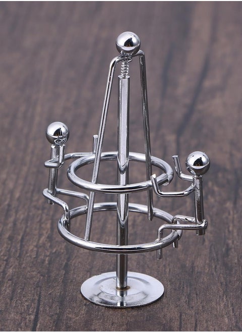 "Enjoy an experience of balance and calm with the Newton's Cradle - elegant design, smooth movement, and a clever decorative touch that adds a sophisticated scientific touch to your office or home. "