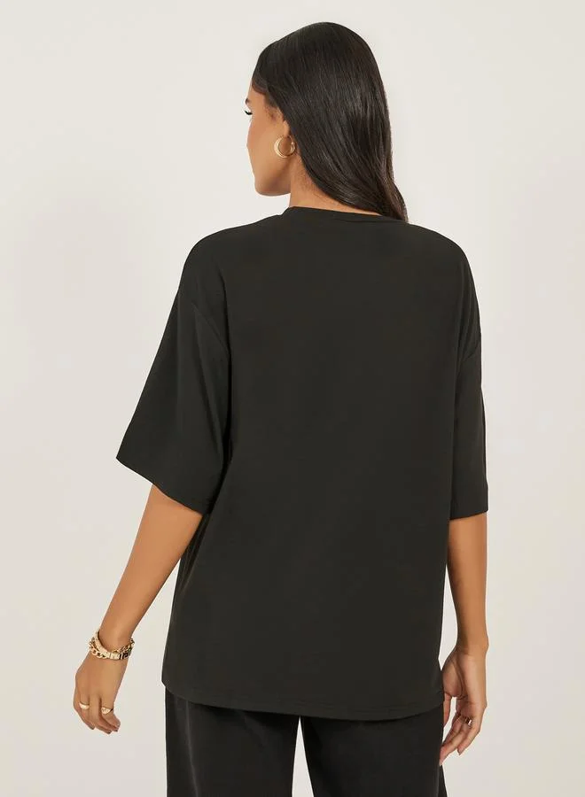 Styli Women Black Oversized Bow Detail Longline T-Shirt