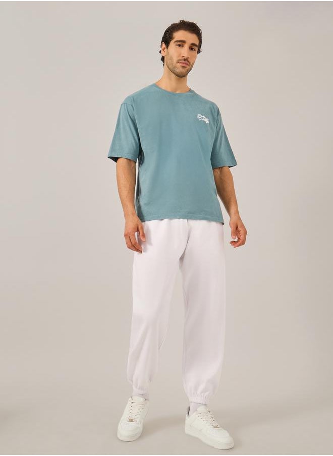 Styli Men White Solid Joggers  - Image 2