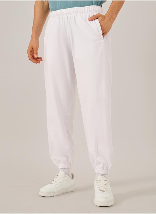 Styli Men White Solid Joggers  - Image 3