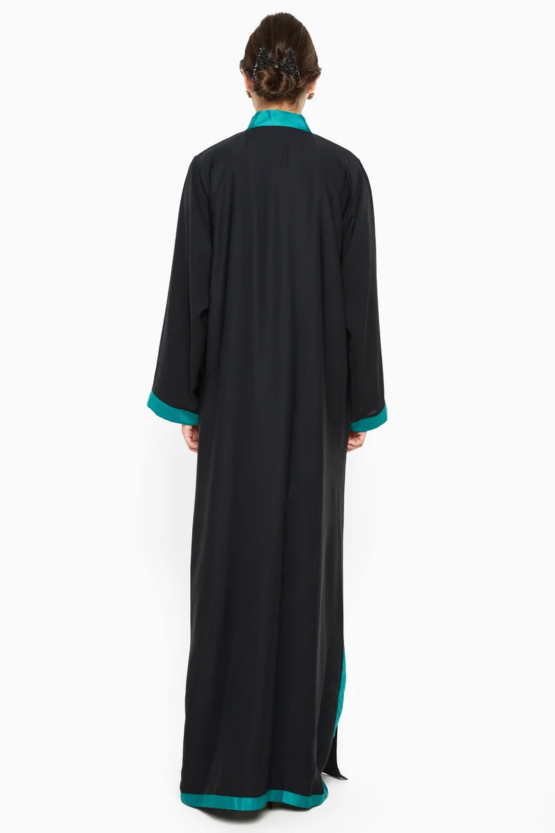 NUKHBAA A gorgeous abaya with shimmering blue satin stripe detail by the sleeves ; side slits and closure .-AJ589A