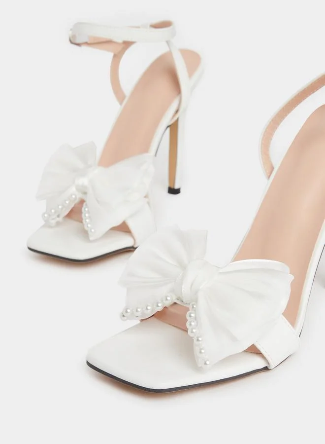 Take Two Embellished Bow Pearl Detail Stiletto Heel Sandals by Styli