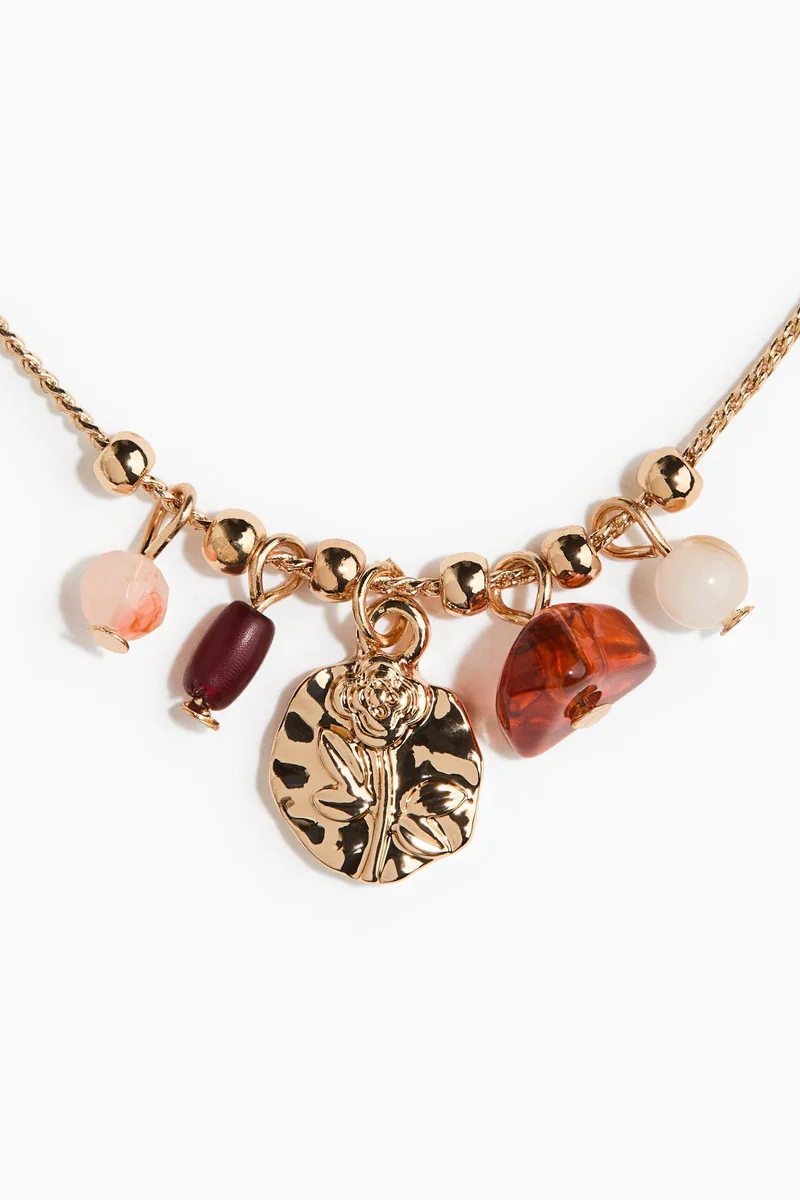 اتش اند ام قلادة مزيّنة بحلية