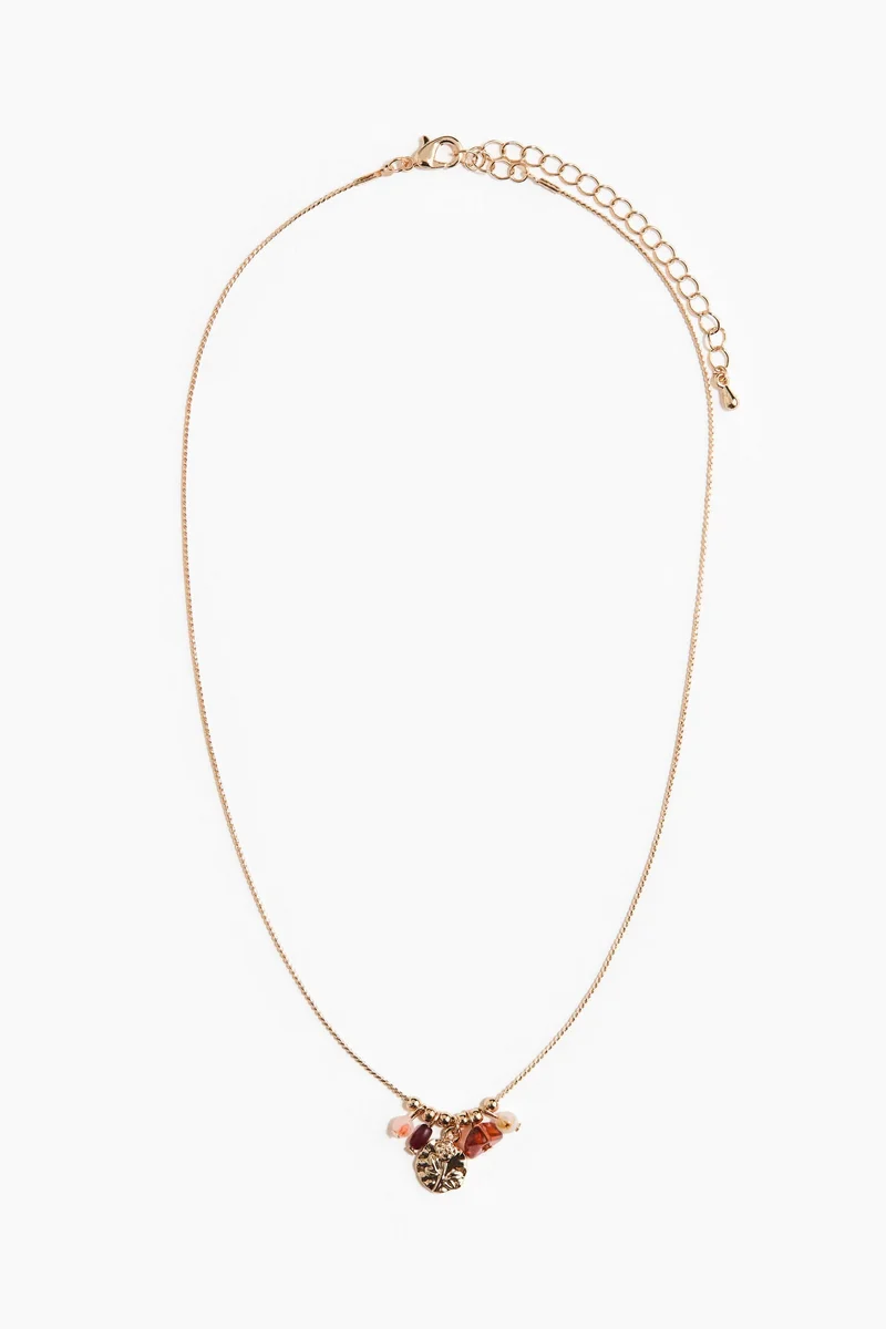 اتش اند ام قلادة مزيّنة بحلية