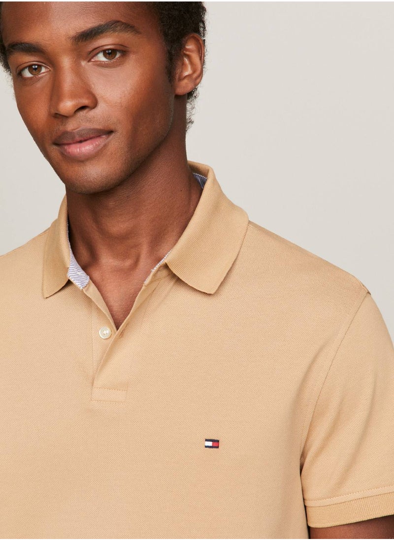 TOMMY HILFIGER - Men's 1985 Collection Flag Embroidery Regular Polo -  Stretch organic cotton, Beige - Image 1