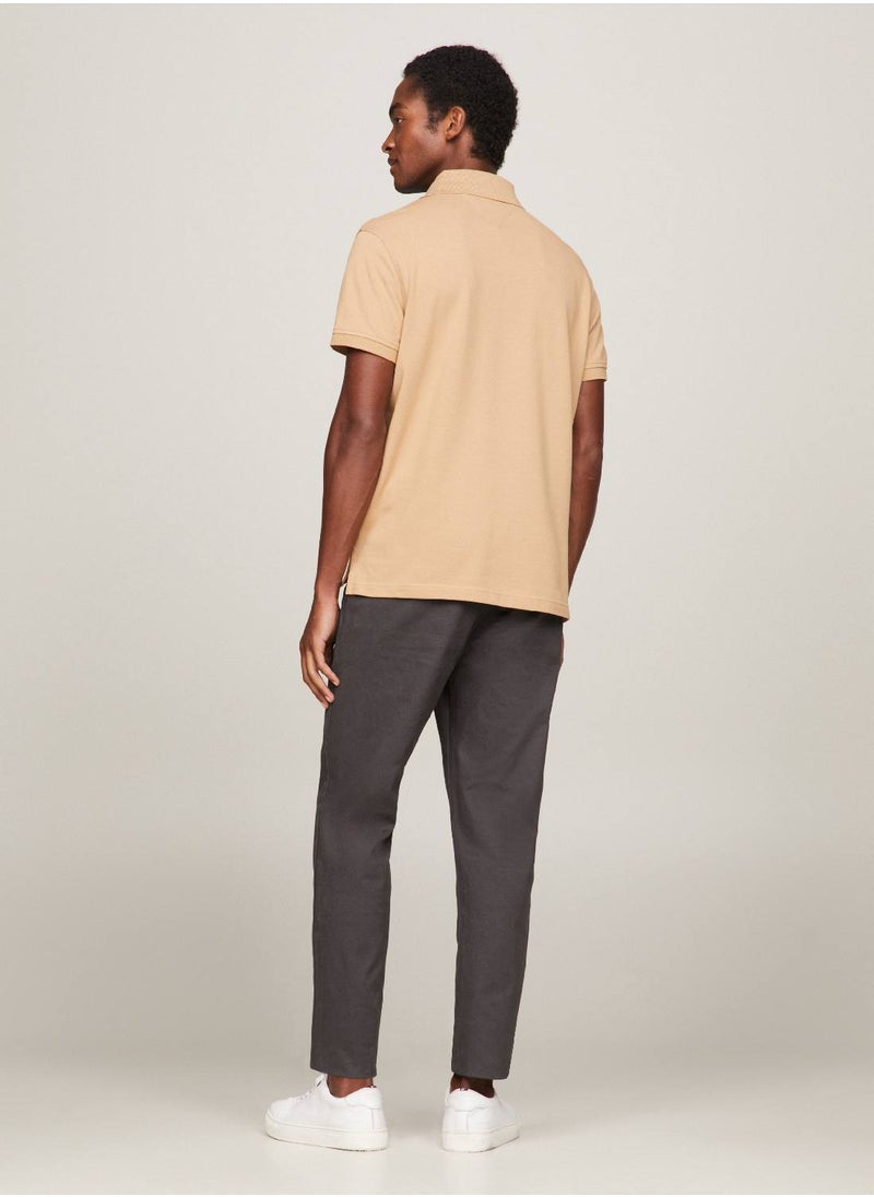 TOMMY HILFIGER - Men's 1985 Collection Flag Embroidery Regular Polo -  Stretch organic cotton, Beige - Image 1