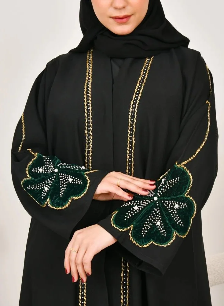 lamha abaya Black wrap abaya with prominent embroidery and olive green velvet overlay on flowers