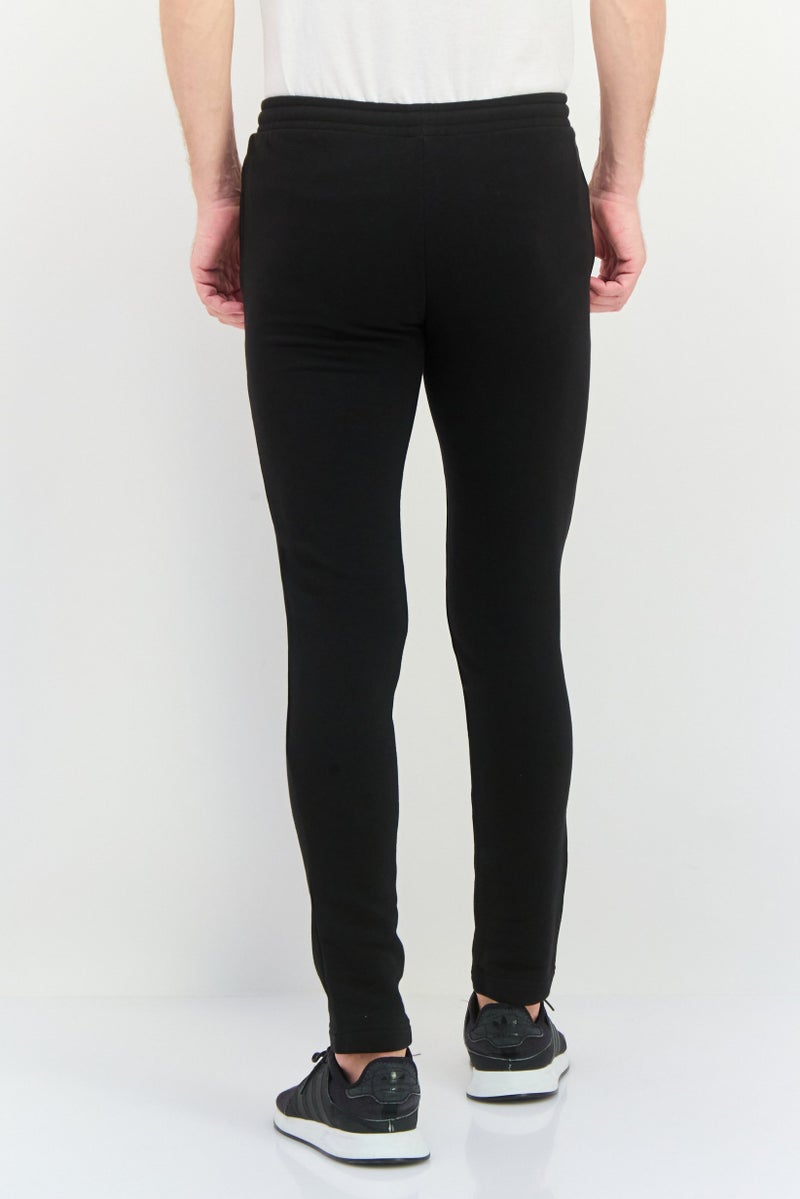 PUMA سروال تدريب ضيق للرجال، أسود - Image 3