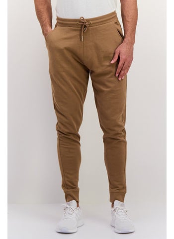 Men Solid Drawstring Jogger Pants, Brown - pzsku/Z6FCF2788DC7A965889FBZ/45/1747054317/0b884528-6c50-43e5-9bf6-368c7a718ee8
