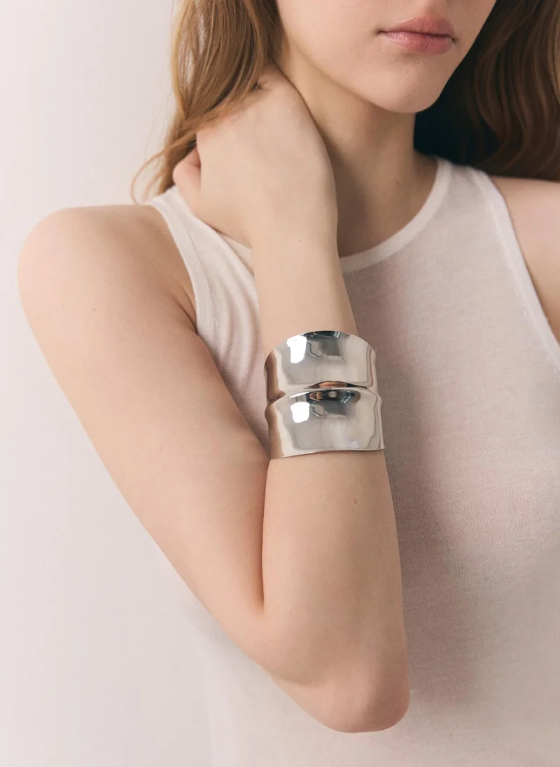 Wide curved metal bracelet