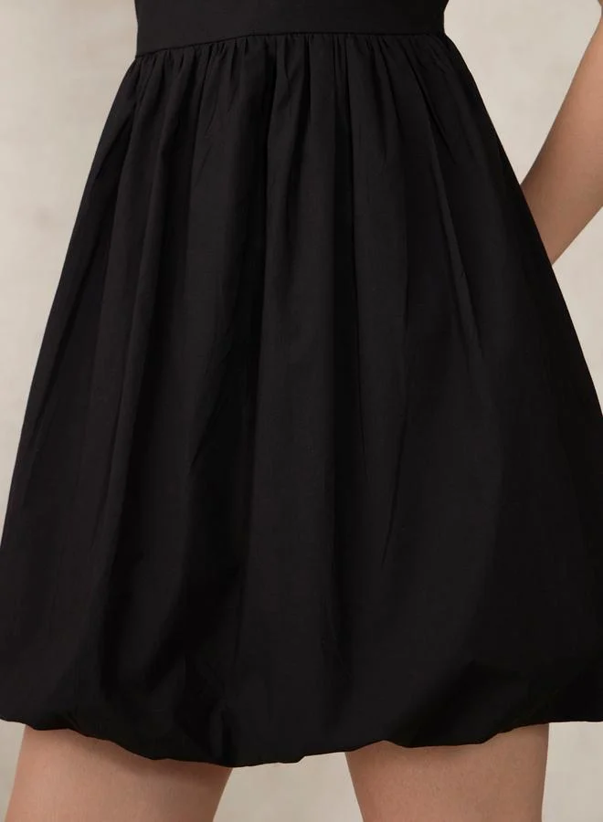 Outzidr  Black Solid Bubble Hem Mini Dress for Women | Best Price UAE