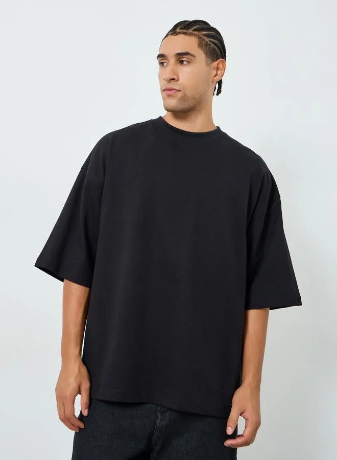 Styli Men Black Boxy Fit Embossed Print T-Shirt