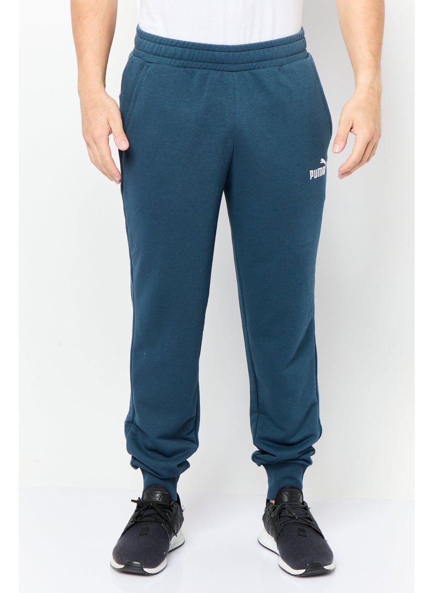 PUMA Men Sportswear Fit Brand Logo Outdoor Sweatpants, Slate Blue  - Image 1