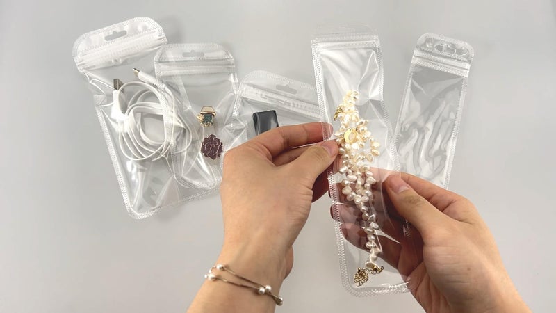 PABCK 100 Pieces Self Sealing Bag with Hang Hole Resealable Zip Storage Lock Clear Plastic Hanging Bags for Packaging Jewelry Decorative Gift 2.16x8.66 inch (usable size 1.77x7.28 inch) - Image 5