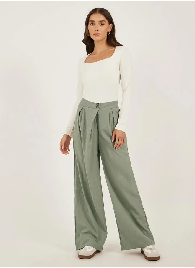 ستايلي Solid Twill Pleated Wide Leg Pants with Cross Waistband