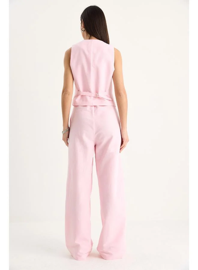 جينجر طقم سترة وبنطلون بقصة مريحة بأزرار