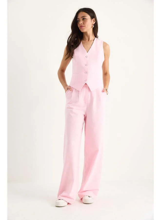 جينجر طقم سترة وبنطلون بقصة مريحة بأزرار