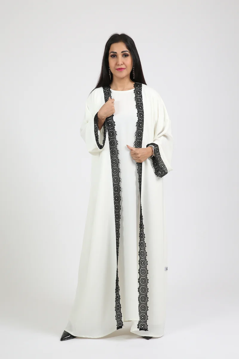 Nikias White nida abaya with inner and black lace on sleeves and front.delicate abaya for work and formal occasions.