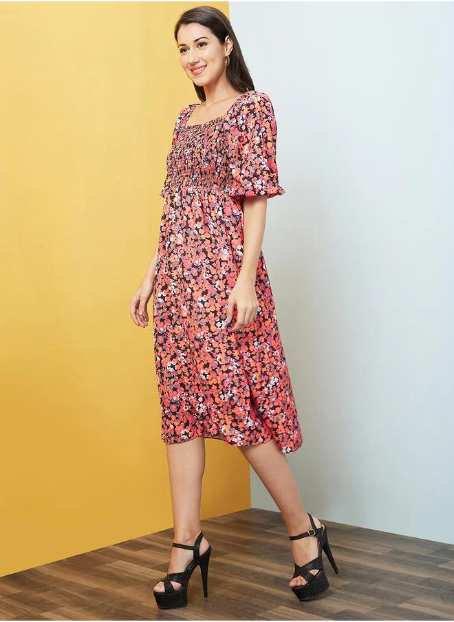 جلو باص All-Over Floral Print Puff Sleeves Square Neck A-Line Midi Dress by Styli