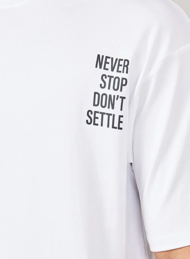 ستايلي Streetwear Front and Black Slogan Print Oversized Interlock T-Shirt