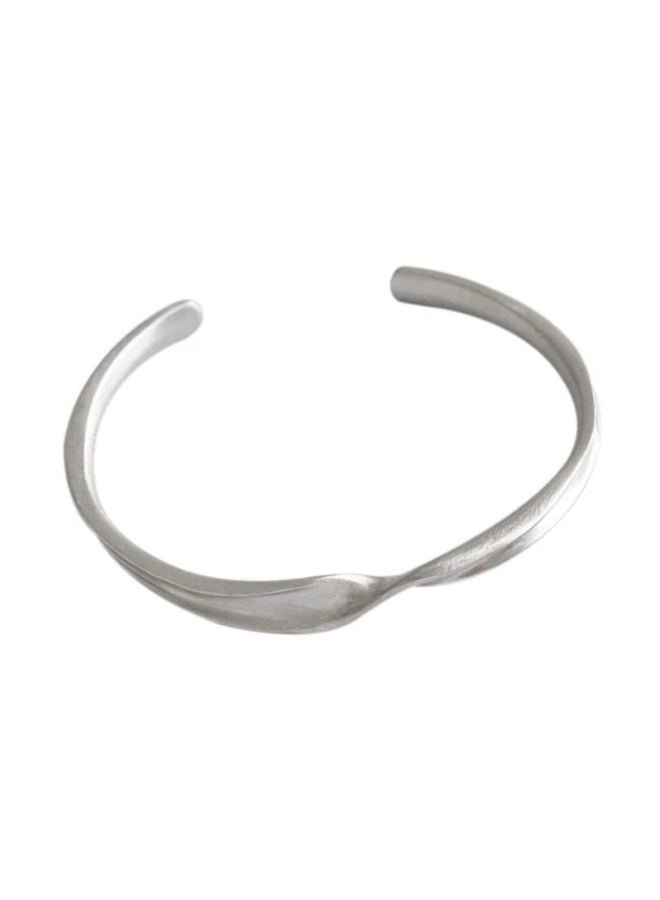 Luxuria An open twist bracelet made of stainless steel, featuring an elegant finish, and often suitable for both men and women. - Image 1