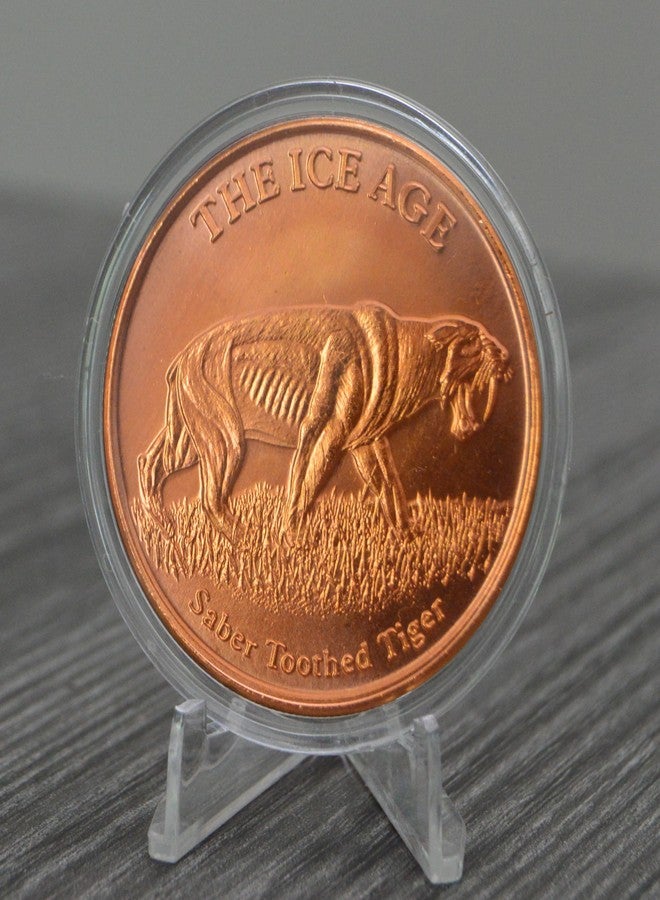 Heavenly Metals عملة معدنية دائرية من النحاس الخالص عيار 999، وزنها أونصة واحدة، عليها صورة نمر ذي أسنان سيفية من العصر الجليدي، مع كبسولة وشهادة أصالة من شركة هيفنلي ميتالز. - Image 4