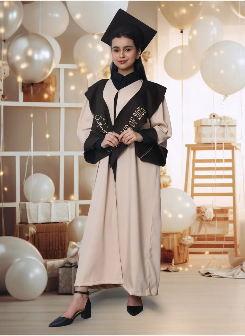 HAWRAA ABAYA Graduation outfit: a beige abaya with brown color inserts on the lining of the sleeves, with a scarf and a plain cap