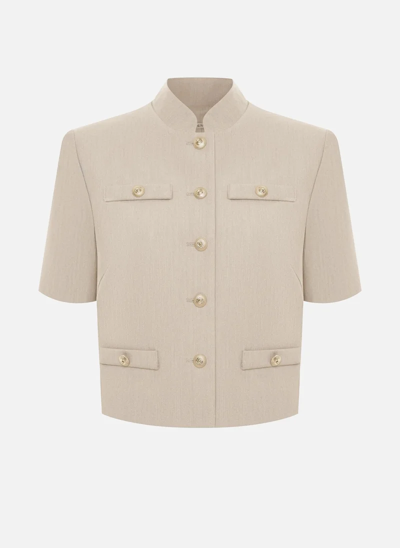 ليتشي سترة بأكمام قصيرة وأزرار كبيرة الحجم