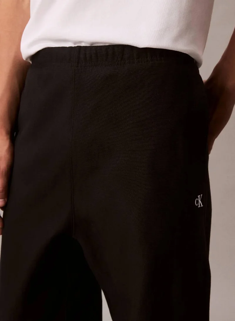 Calvin Klein Jeans Black Cotton Terry Monogram Joggers for Men | Best Price UAE