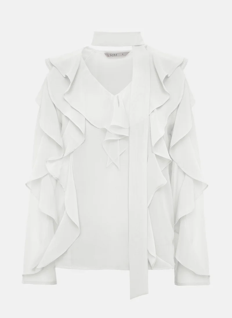 Lichi Semi-transparent blouse with flounces and ribbon scarf