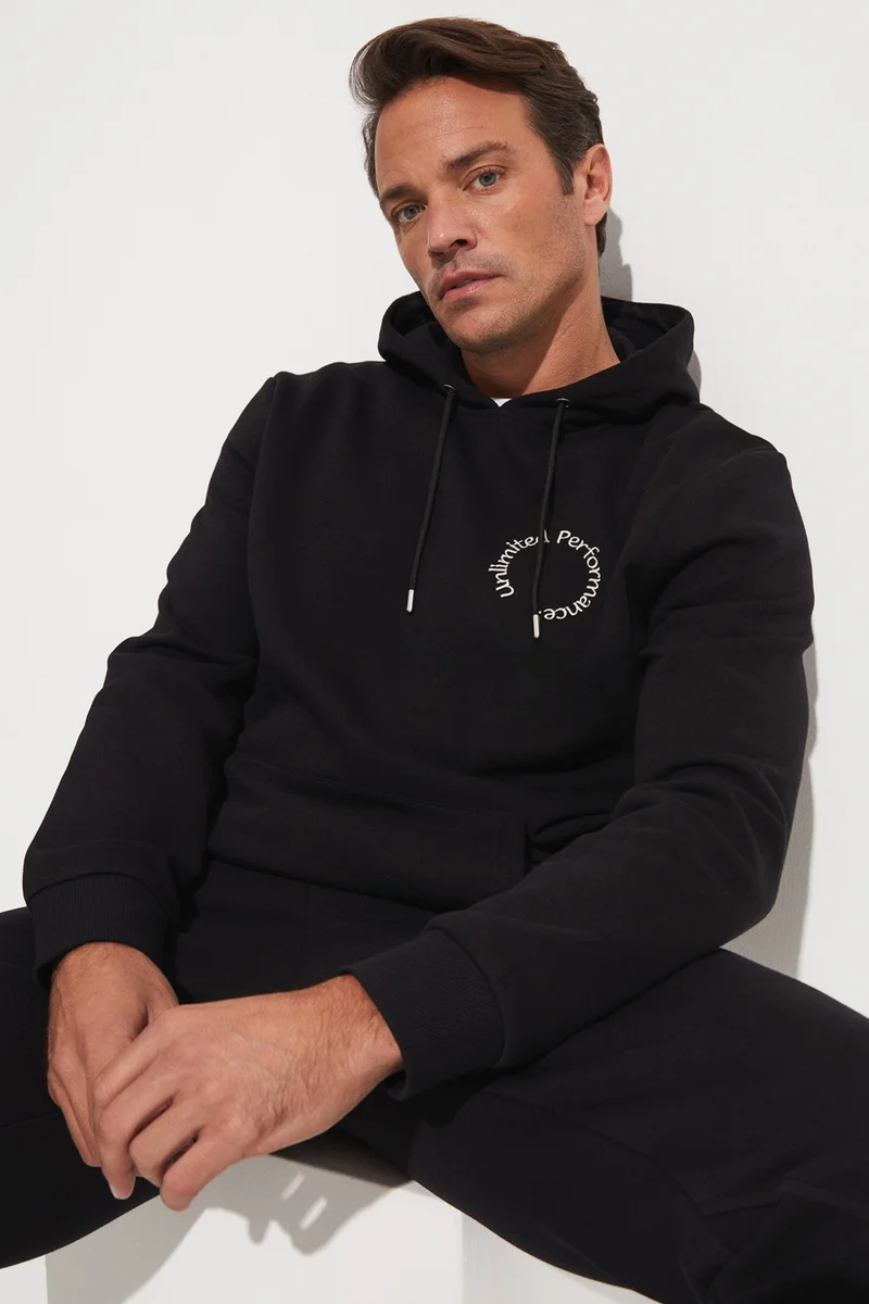 جويستار Men's Regular Fit Kangaroo Pocket Hooded Slogan Embroidered Sweatshirt