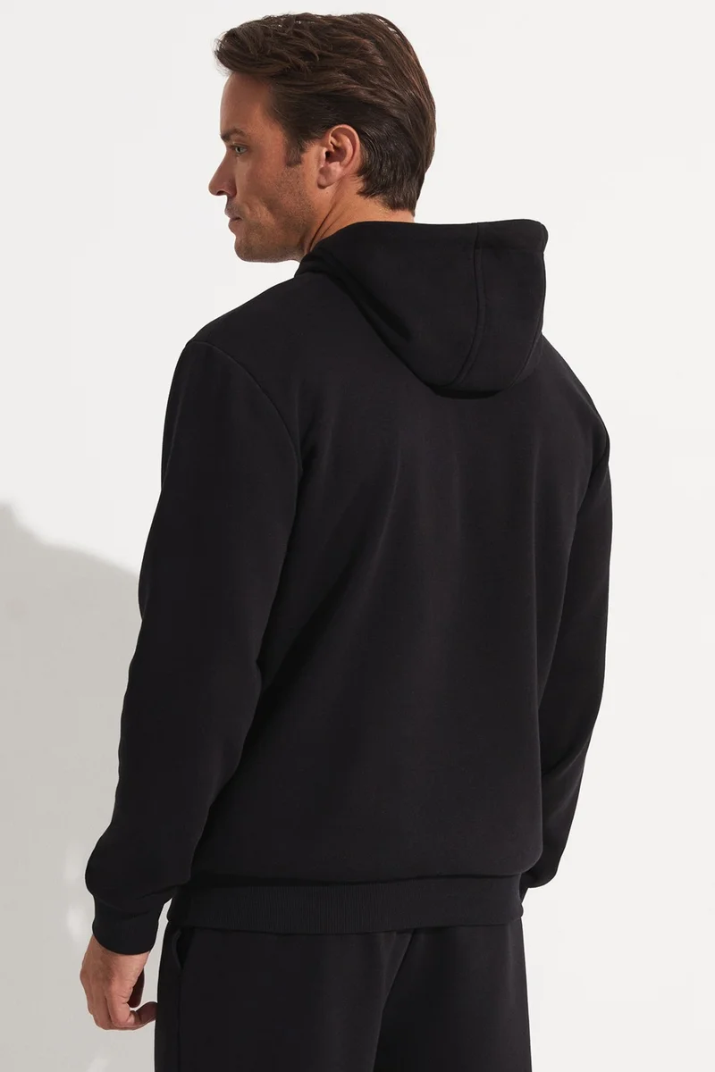 جويستار Men's Regular Fit Kangaroo Pocket Hooded Slogan Embroidered Sweatshirt
