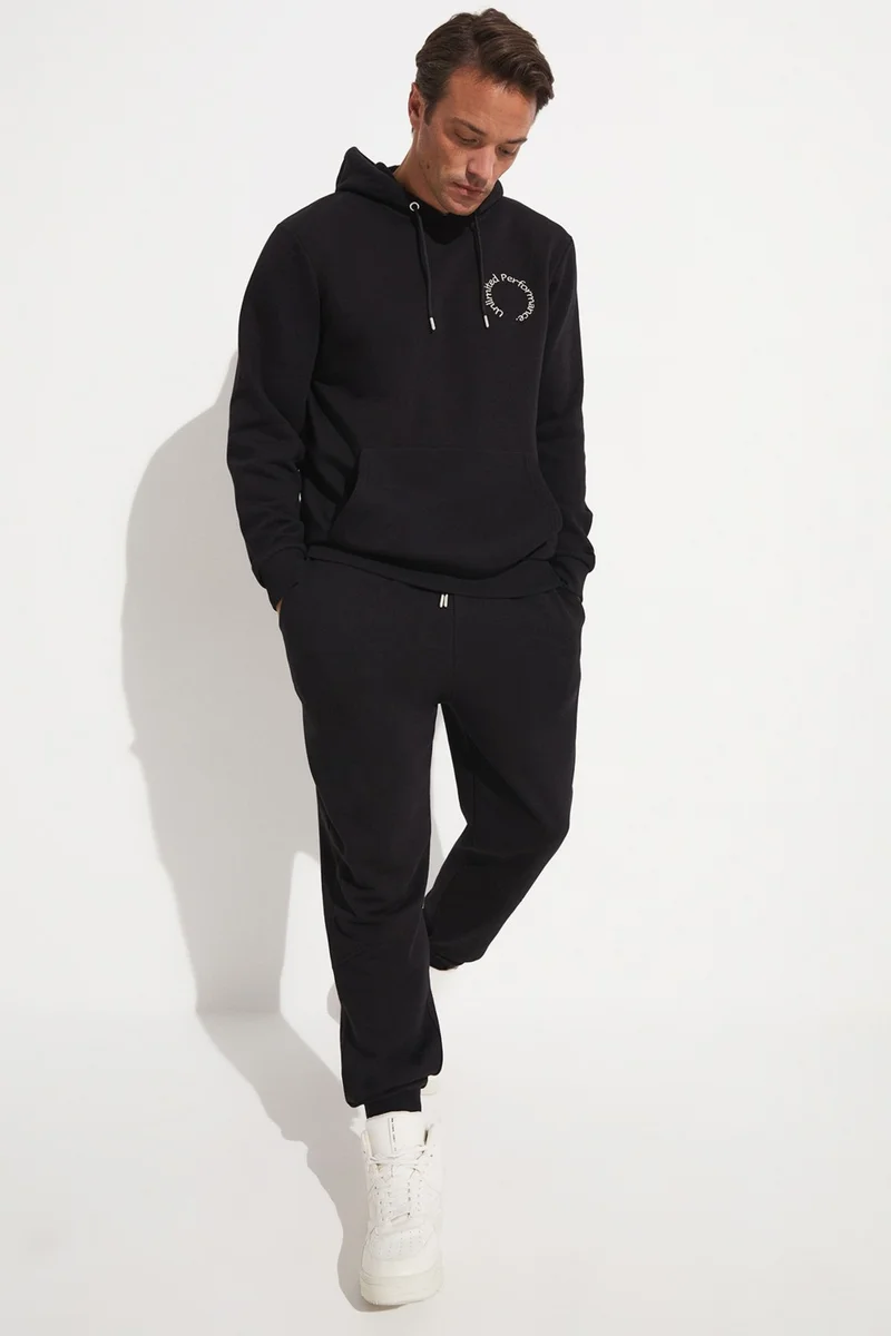 جويستار Men's Regular Fit Kangaroo Pocket Hooded Slogan Embroidered Sweatshirt