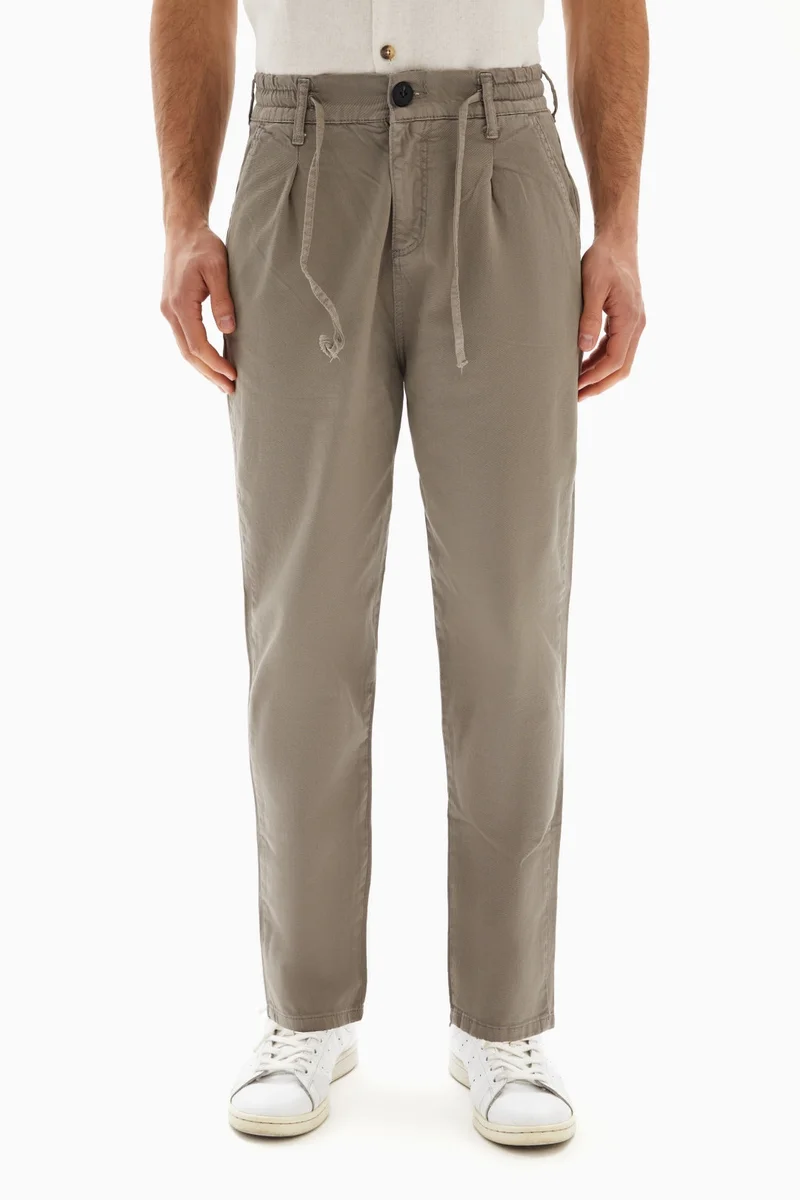 Wecre8 Taupe Drawstrings Slim Trousers By WECRE8