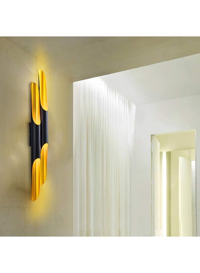 Modern wall sconce with top and bottom lighting in a distinctive cylindrical design - black and gold color - Image 3