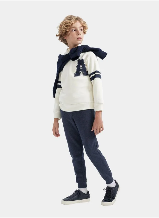 ديفاكتو Graphic Print Hooded Sweatshirt & Joggers Set by Styli